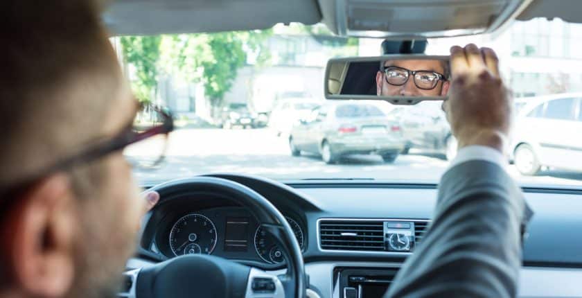 Physician Leader looking into mirror